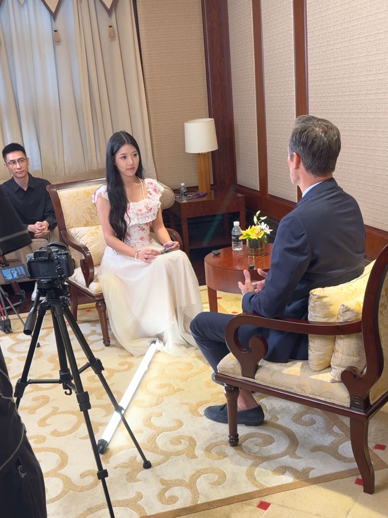 Media interview — a delegate interviewed on camera after the forum — China