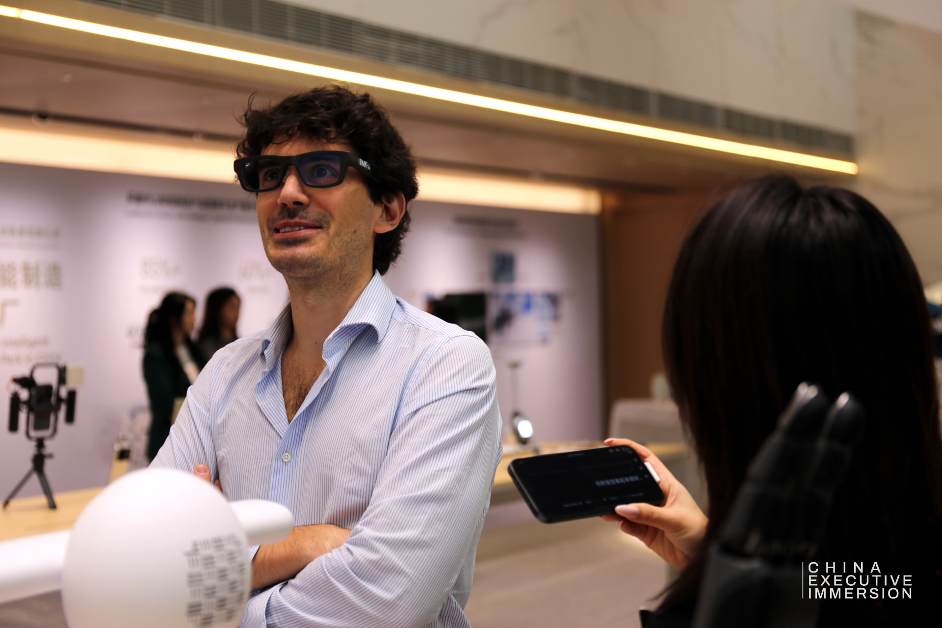 HONOR — a delegate wearing the AI glasses on the showroom floor — Shenzhen