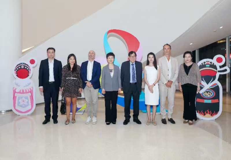 Institutional visit — hosts and delegates after a closed-door meeting — China