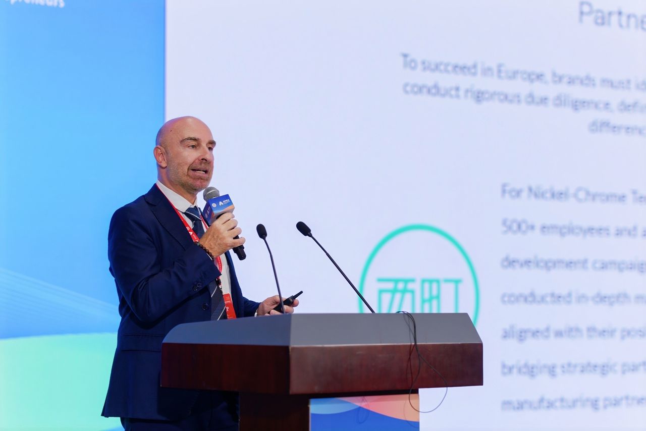 Asia-Pacific Entrepreneurs Forum — a delegate speaking from the main podium on Europe–China partnerships — Hubei